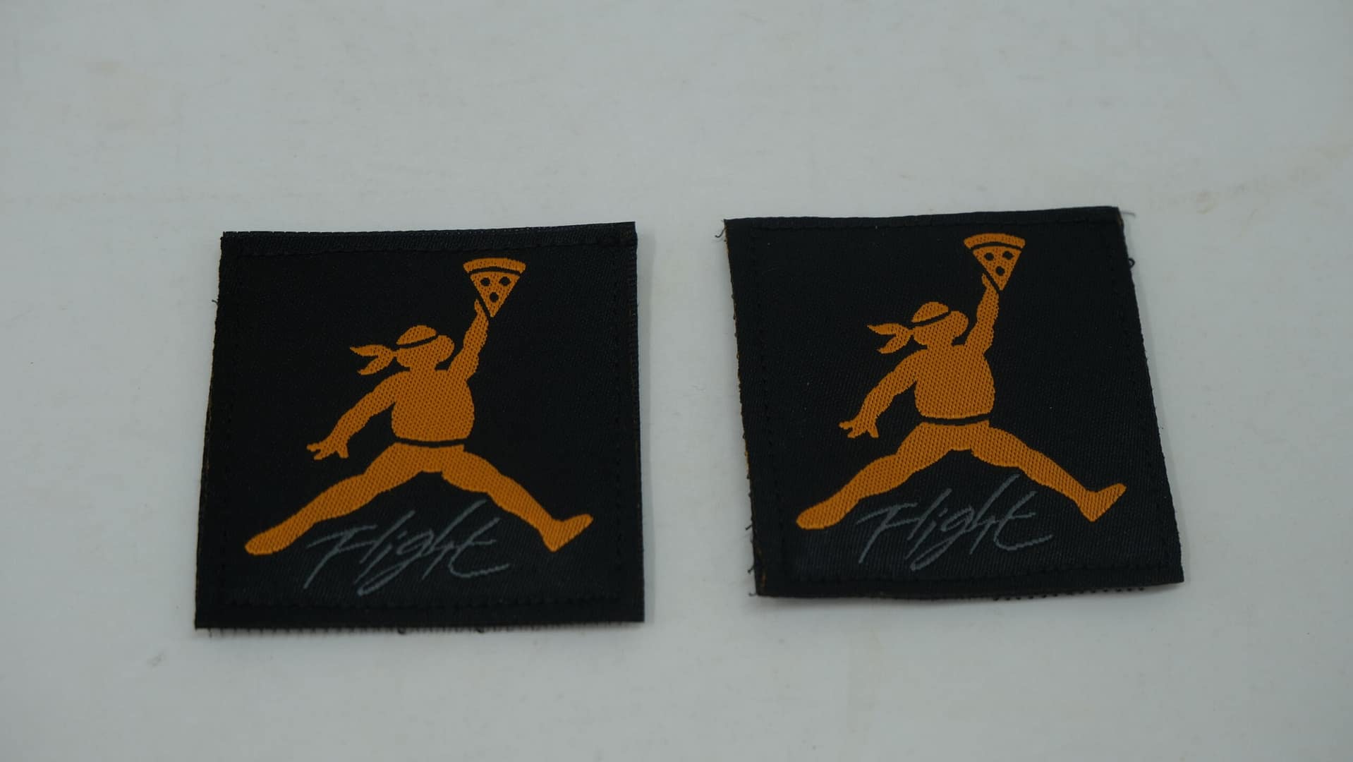 AJ4 Black Orange “Flight" Undftd Tags